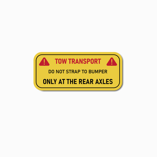 Yellow warning label with black text on a white background